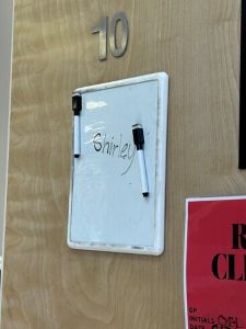 white board with name Shirley on it