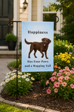 12 × 18 Brookline Lab Rescue garden flag featuring an exclusive chocolate Labrador illustration with the phrase "Happiness Has Four Paws and a Wagging Tail" displayed in a landscaped front yard.