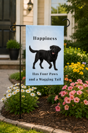 12 × 18 Brookline Lab Rescue garden flag featuring an exclusive black Labrador illustration with the phrase "Happiness Has Four Paws and a Wagging Tail" displayed in a landscaped front yard.