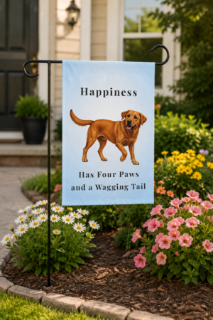 Light blue garden flag featuring a fox red Labrador Retriever and the saying "Happiness Has Four Paws and a Wagging Tail" displayed in a colorful flower garden outside a welcoming home.