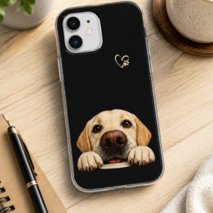 Hopeful Eyes Yellow Labrador Retriever Flexi phone case displayed on a modern wood desk with a notebook, coffee mug, and plant, showcasing the original Yellow Labrador artwork created for Brookline Lab Rescue.